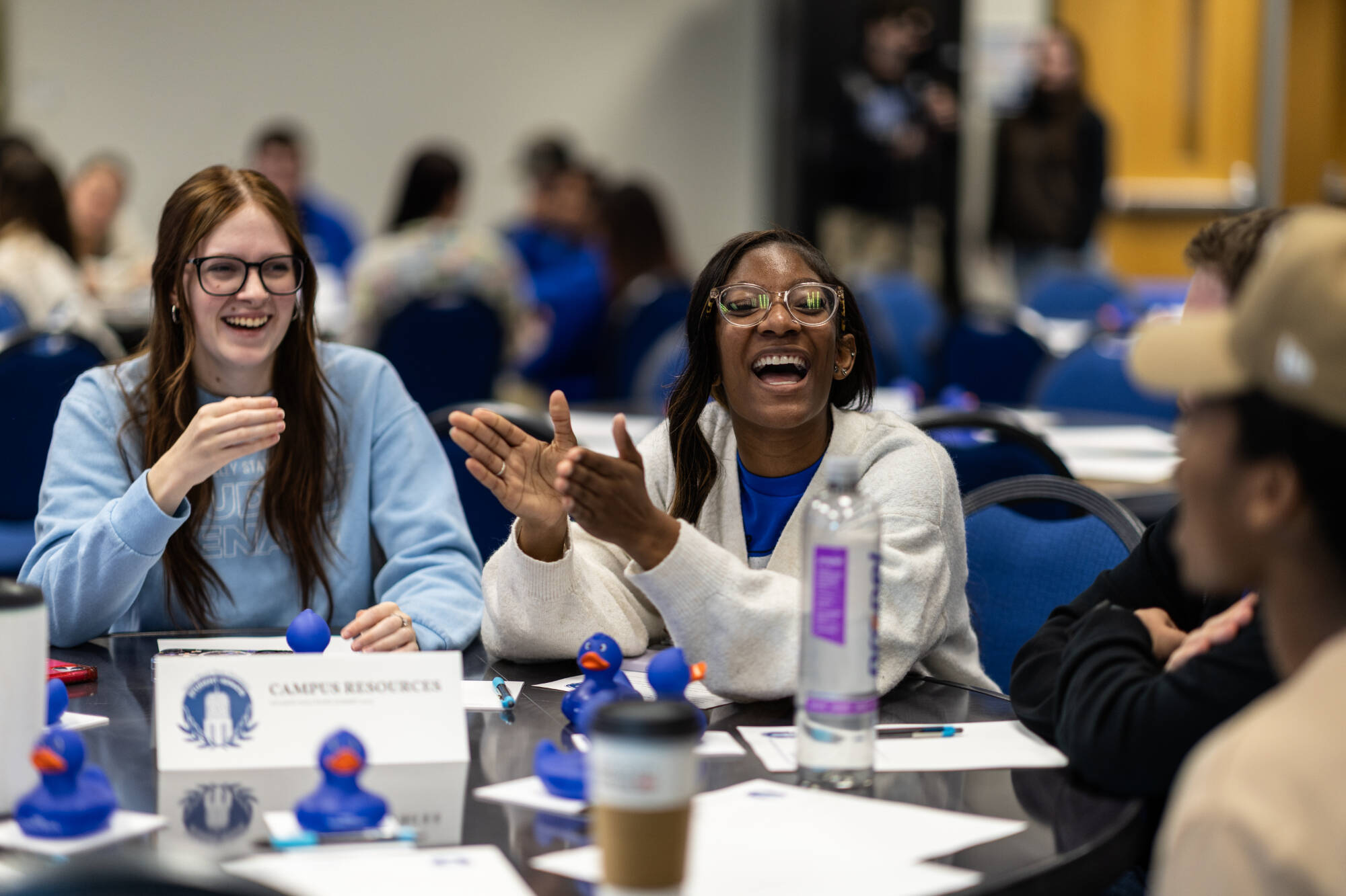 Two Student Senators laughing during an event.